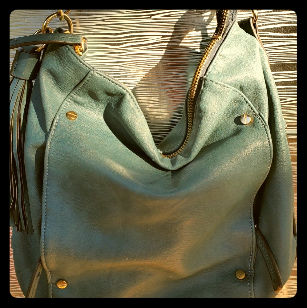 blue tasseled leather pocketbook